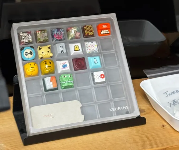 A box with various decorative keycaps