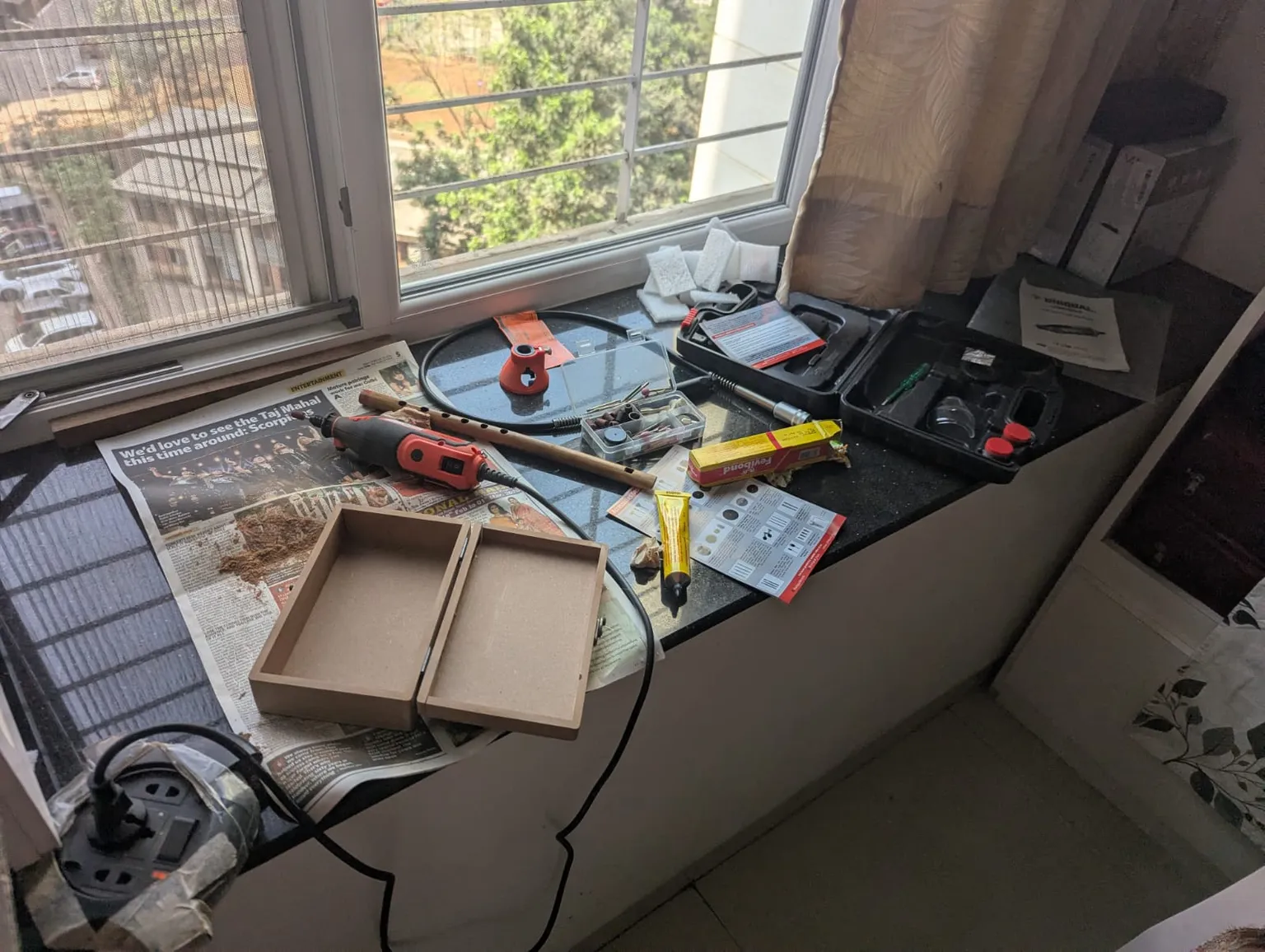 A lot of scattered equipment and an unassuming wooden box