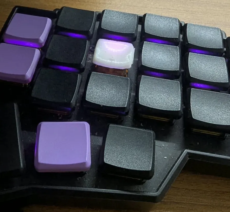 A 3D printed keycap nestled among my MBK blanks